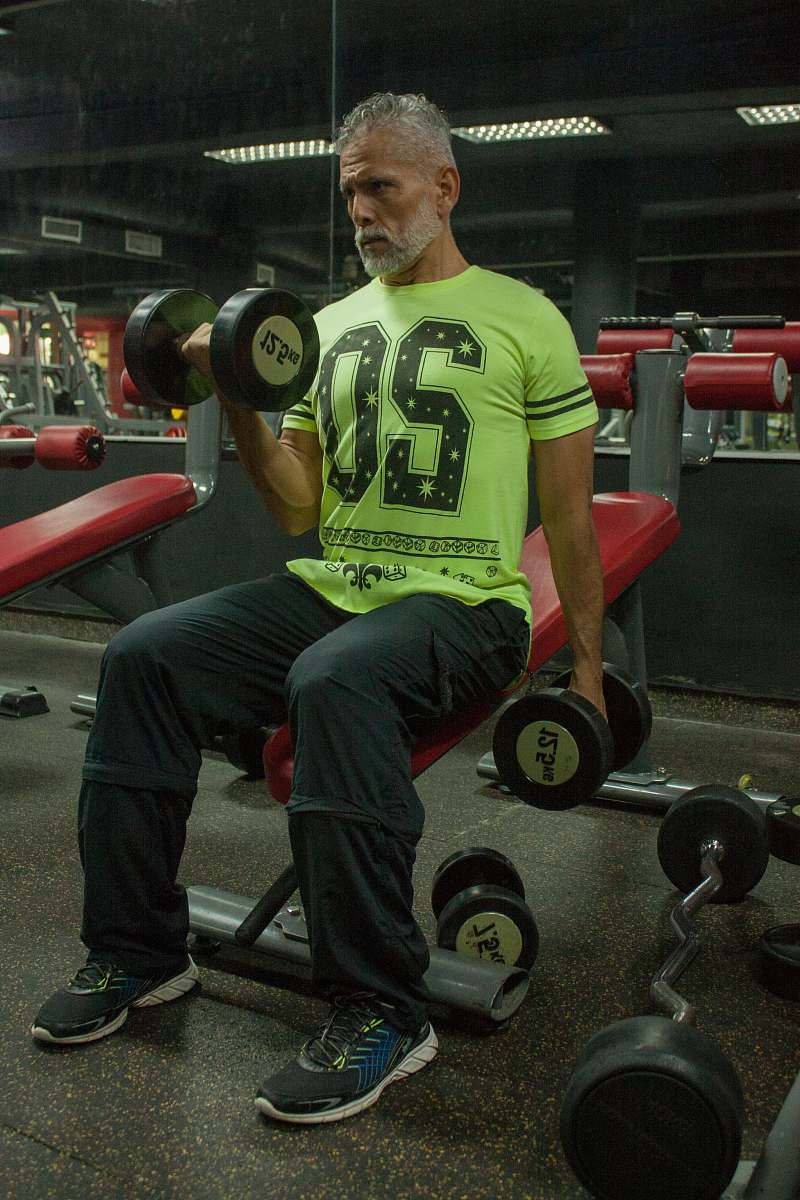 clothing person lifting weights close-up photography footwear