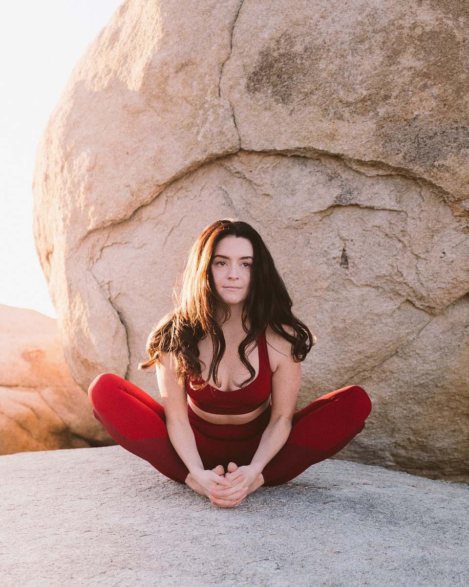 clothing woman doing yoga rock