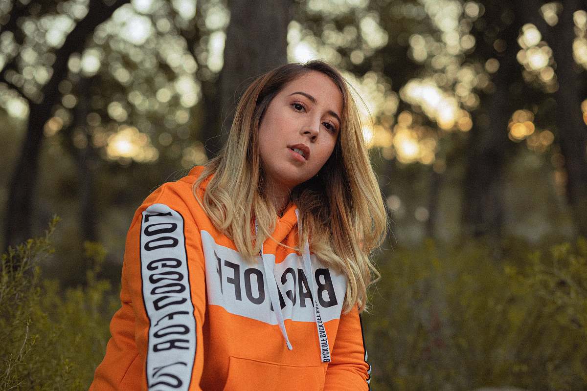 clothing woman in orange hoodie sweater