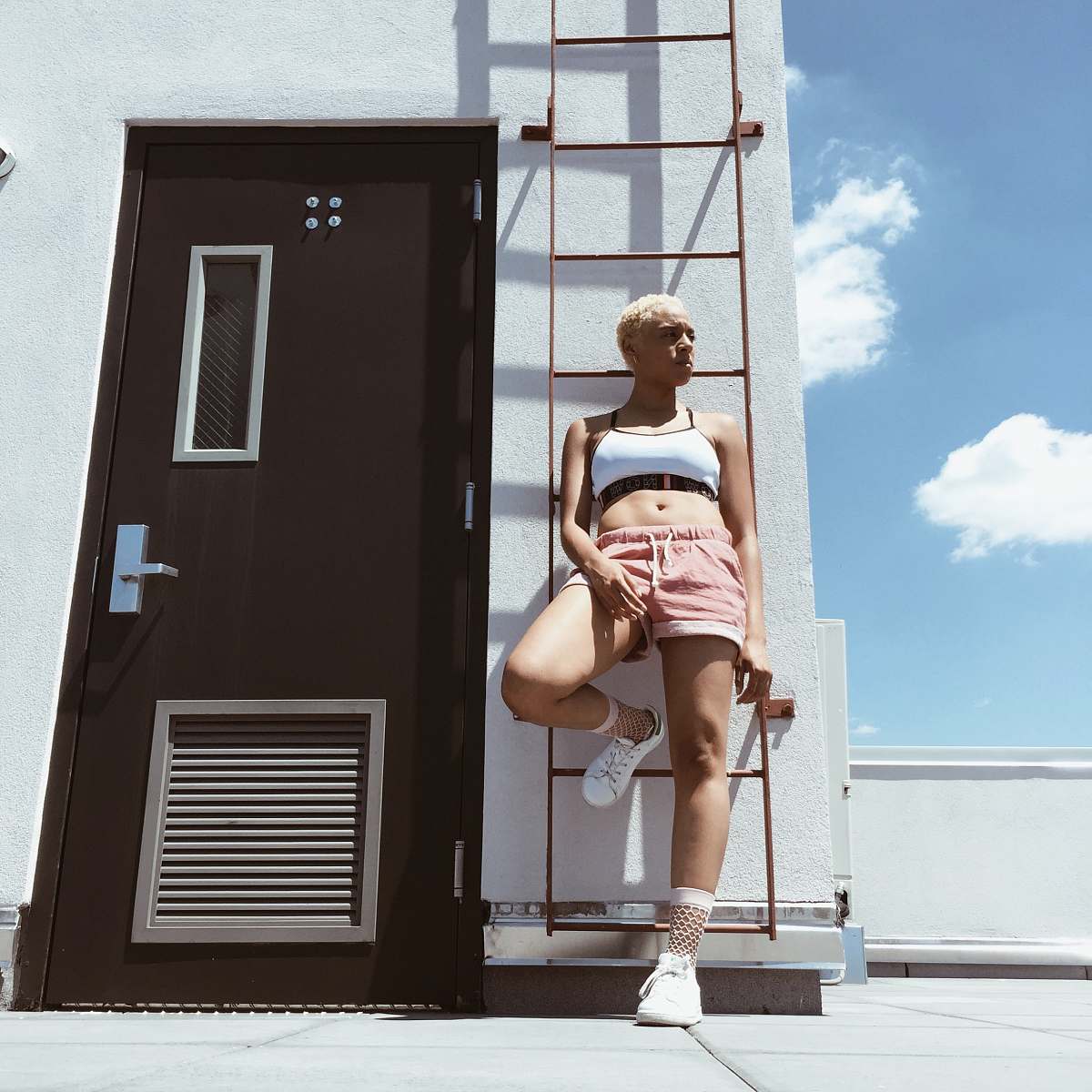 clothing woman standing near door door