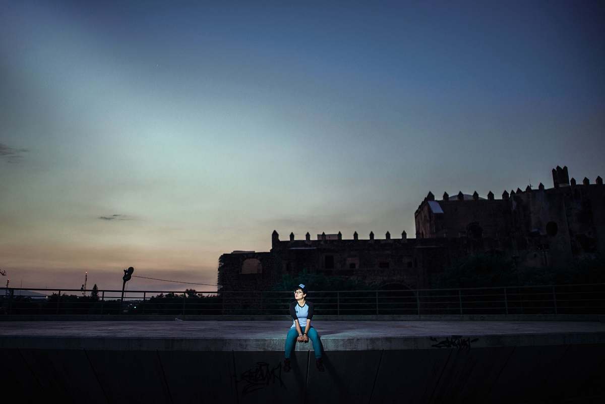 building boy sitting on the edge of the building castle