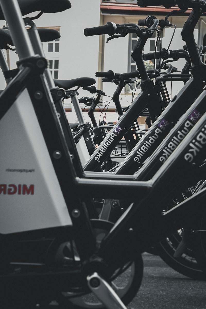 bike black PubliBike bikes parked near building transportation