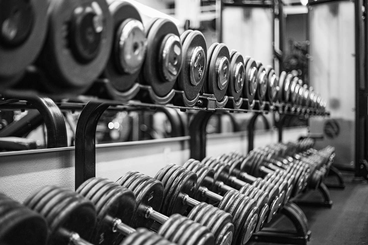 black-and-white gray scale photo of dumbbells factory