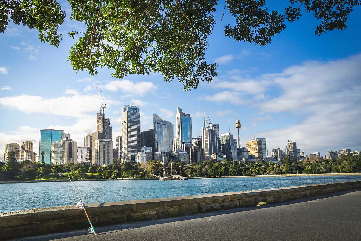 city panoramic photo of high rise buildings near body of water during daytime town