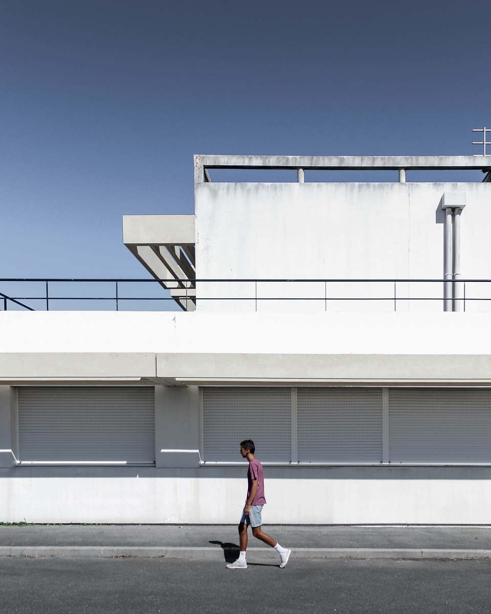 apparel man near house shorts