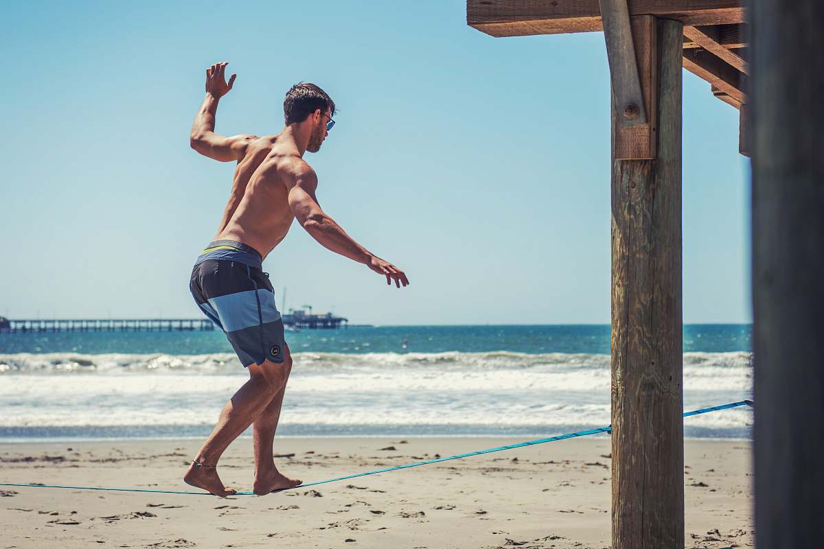 apparel man walking on blue rope shorts