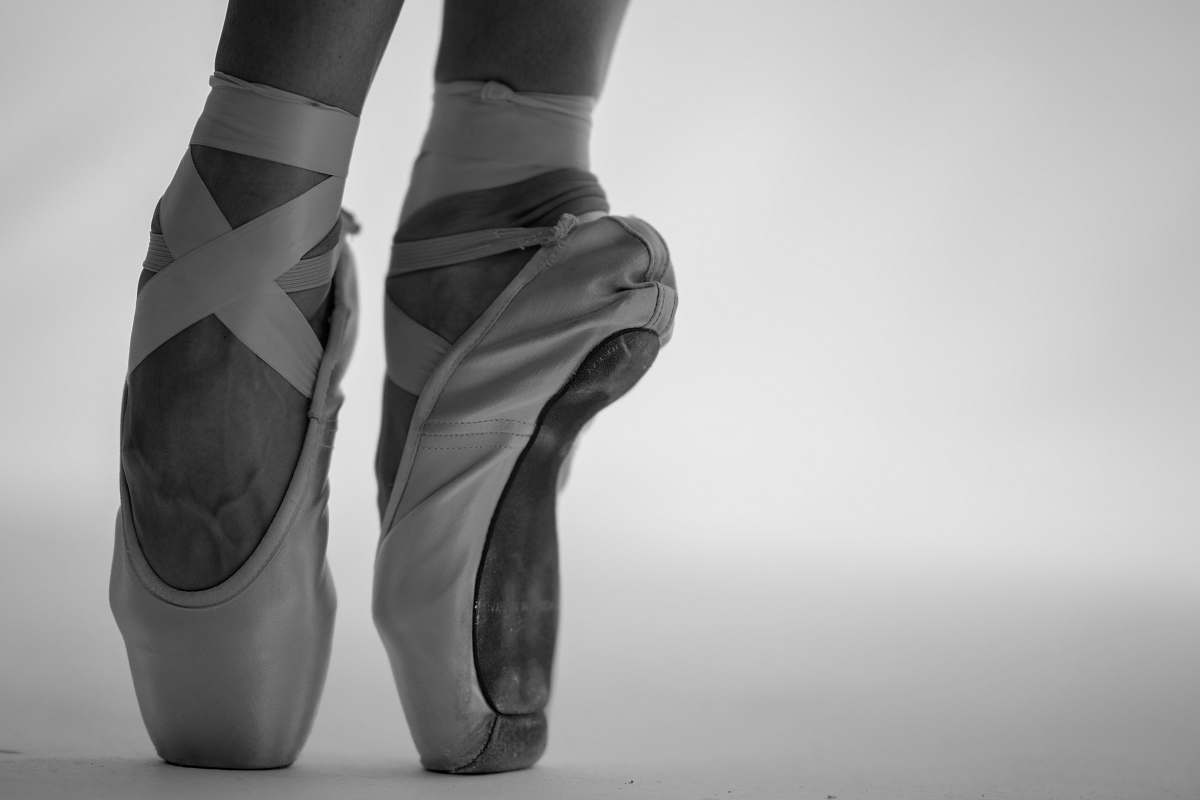 apparel person in ballet shoes black-and-white