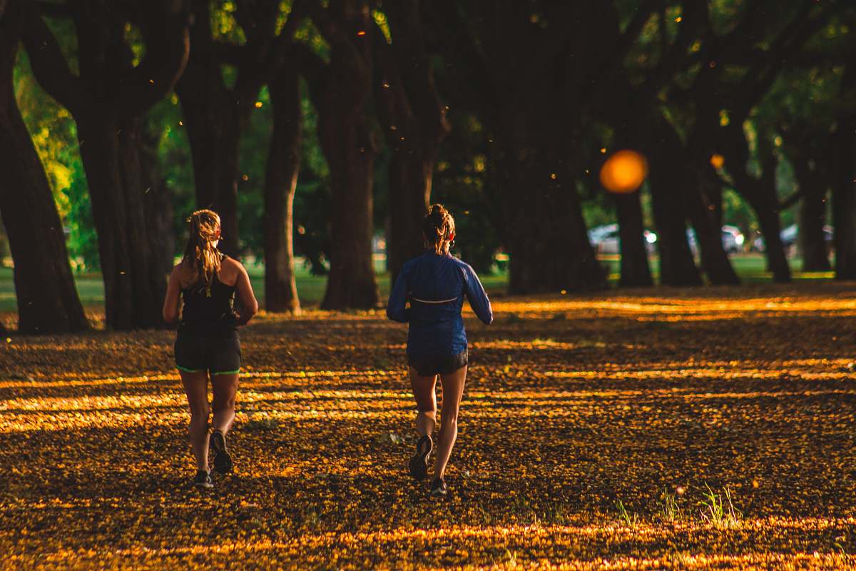 human two women running on park person