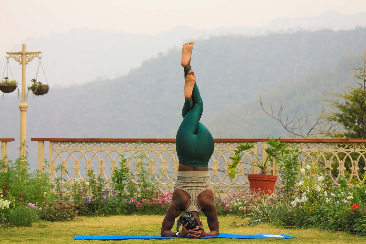 person woman doing fitness headstand human