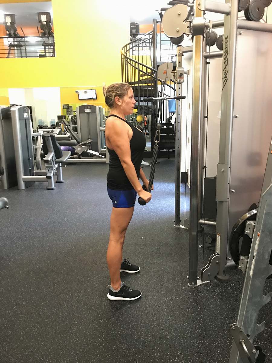 fitness woman in black tank top standing inside gym human