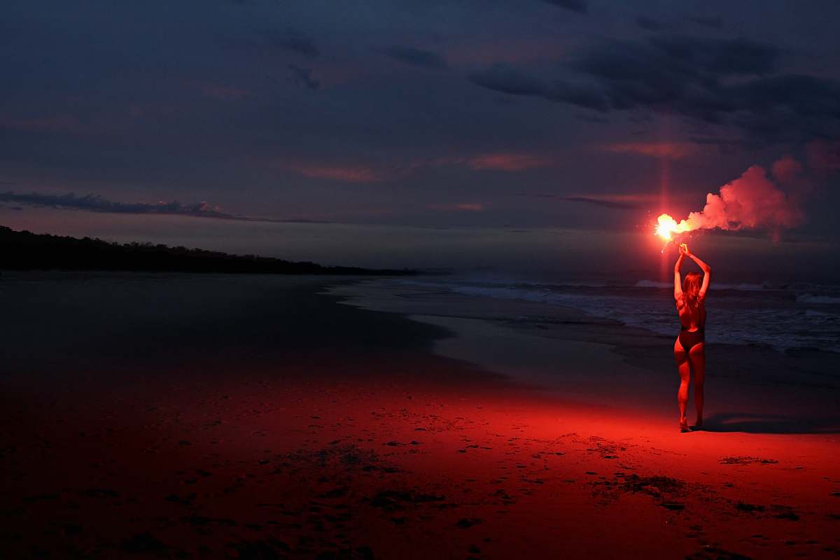 nature woman standing while holding firecrackers light