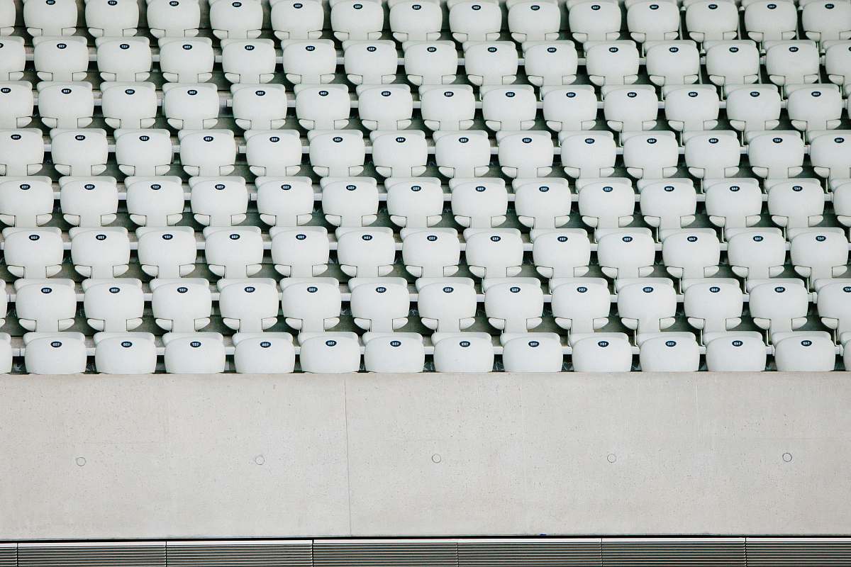 london white seats with gray concrete platform london aquatics centre (stop j)