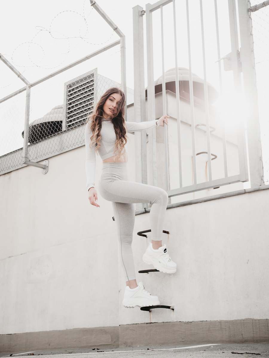 clothing woman in white crop top holding white rail apparel