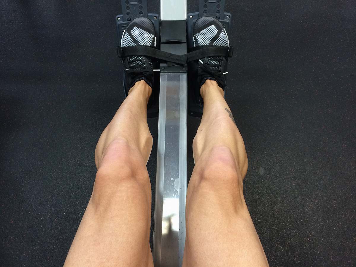 row person sitting on rowing machine crosstraining