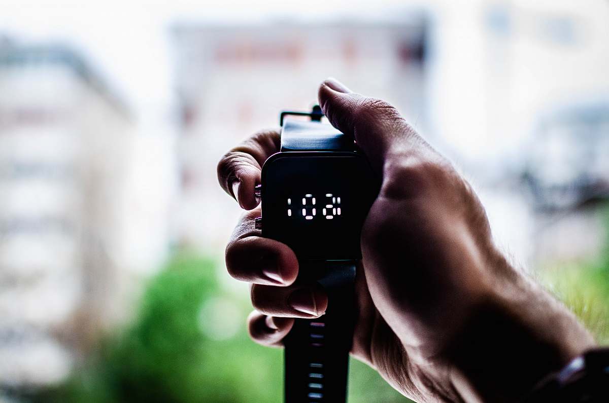 watch person holding digital watch digital