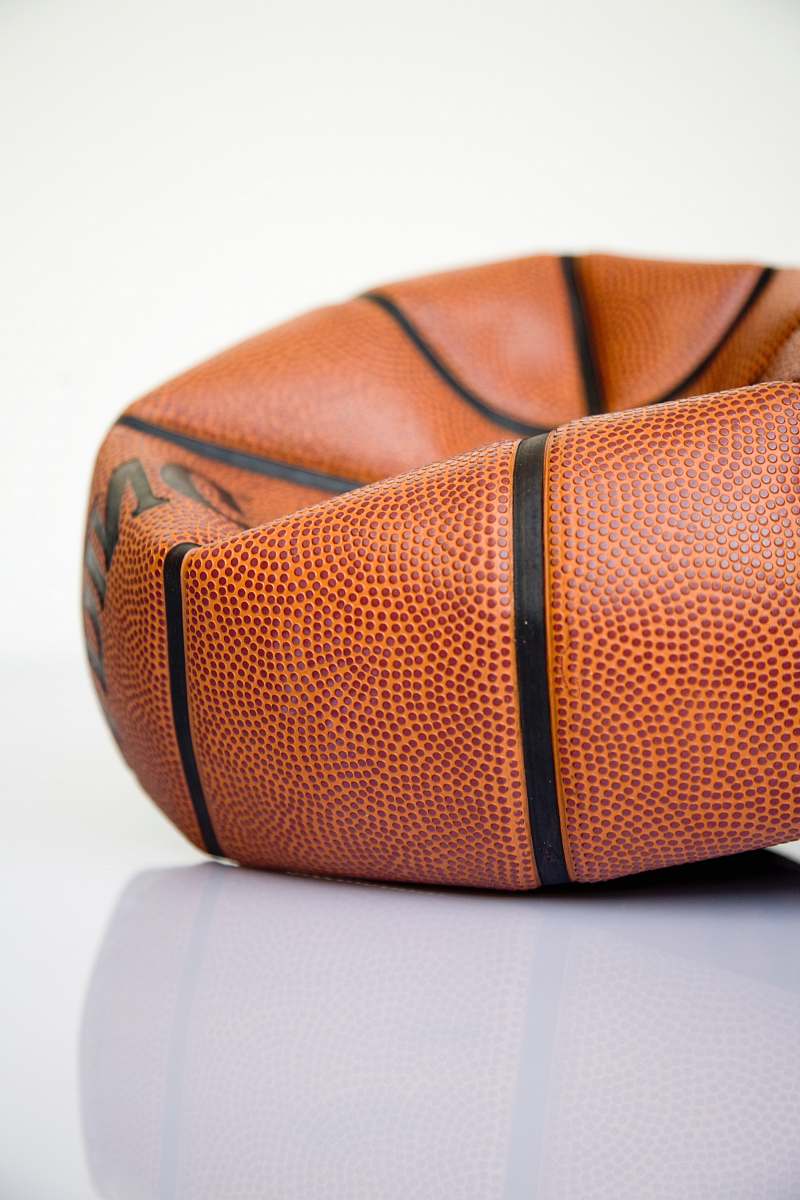 accessory brown basketball ball on white surface purse