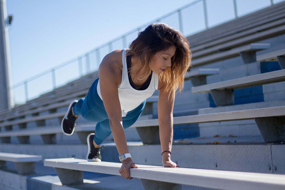banister woman exercising in stage during daytime human