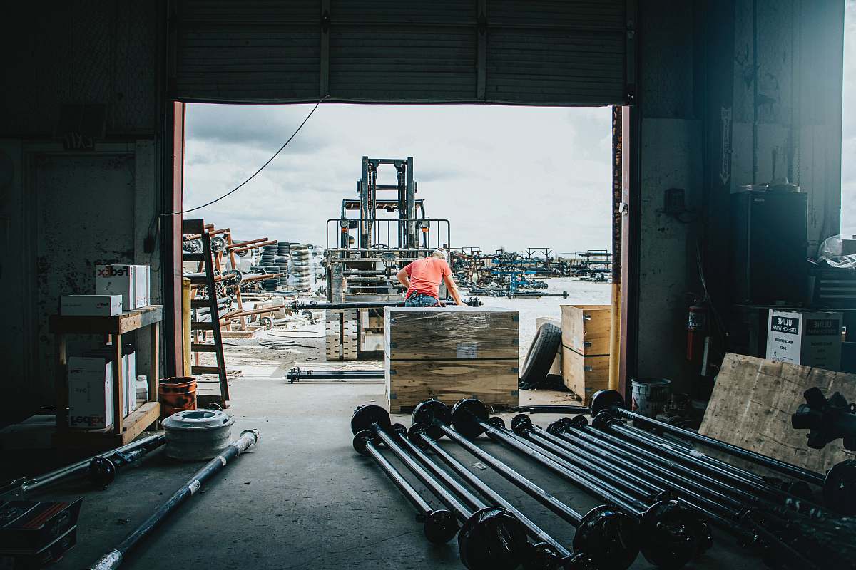 person assorted metal rods inside garage exercise