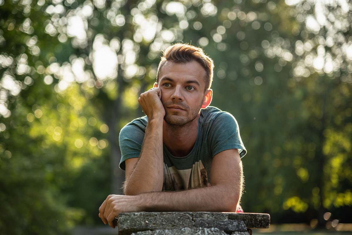person bokeh photography of man man