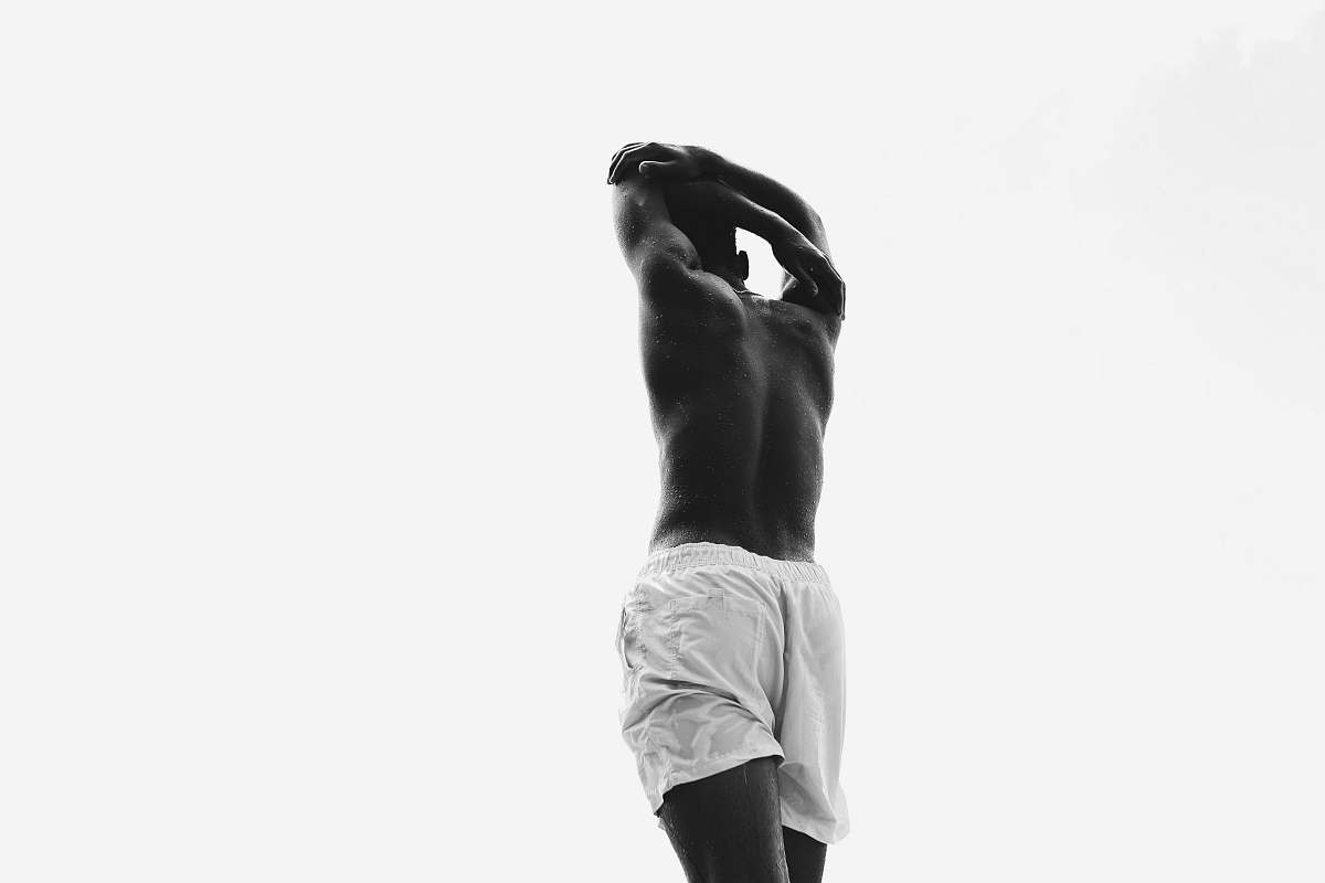 person grayscale photo of man in light colored boxer shorts black-and-white