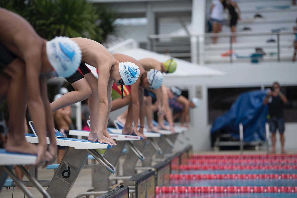 person group of men attending on swimming competition people