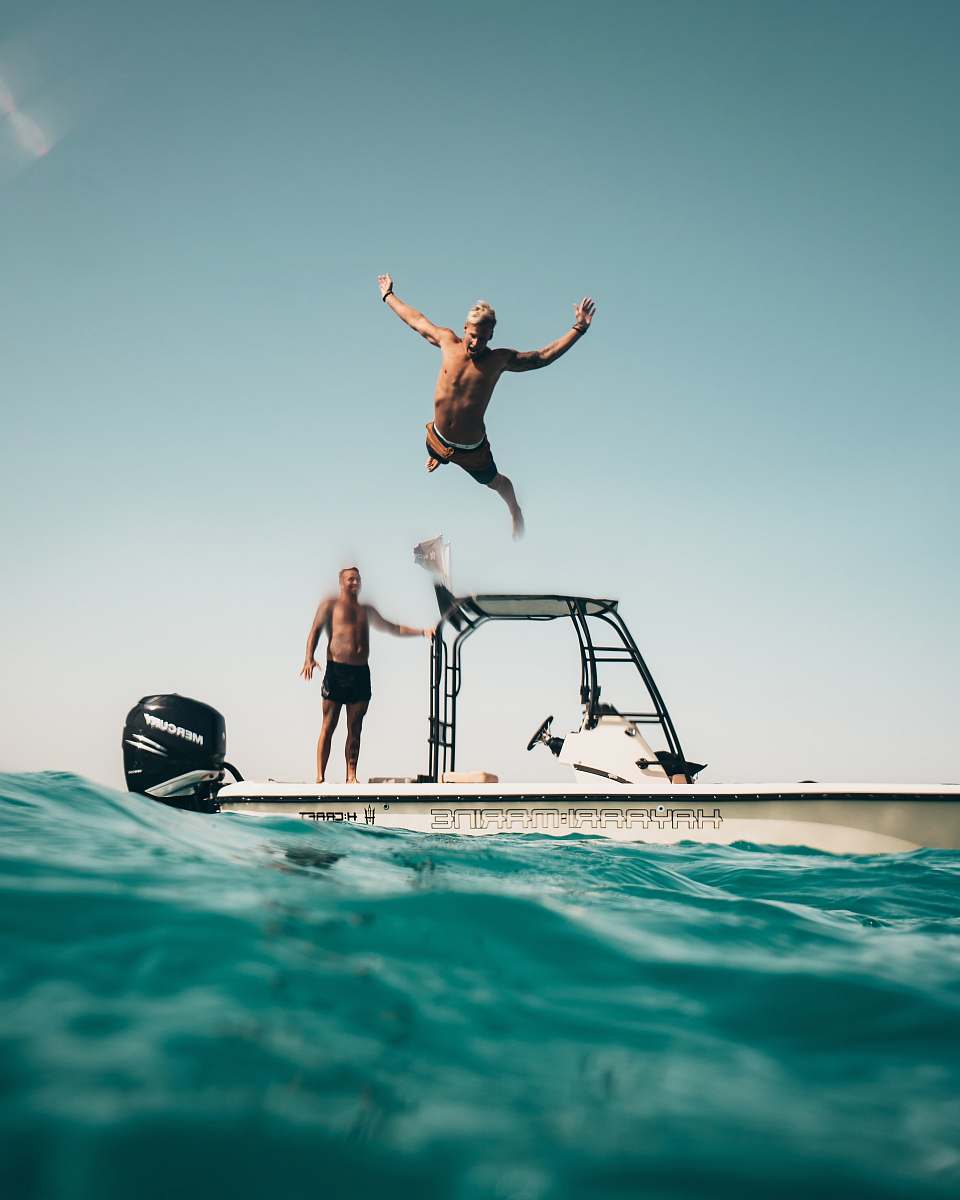 person man diving on pool people