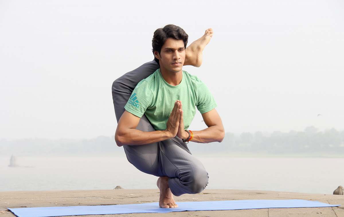 person man doing yoga people