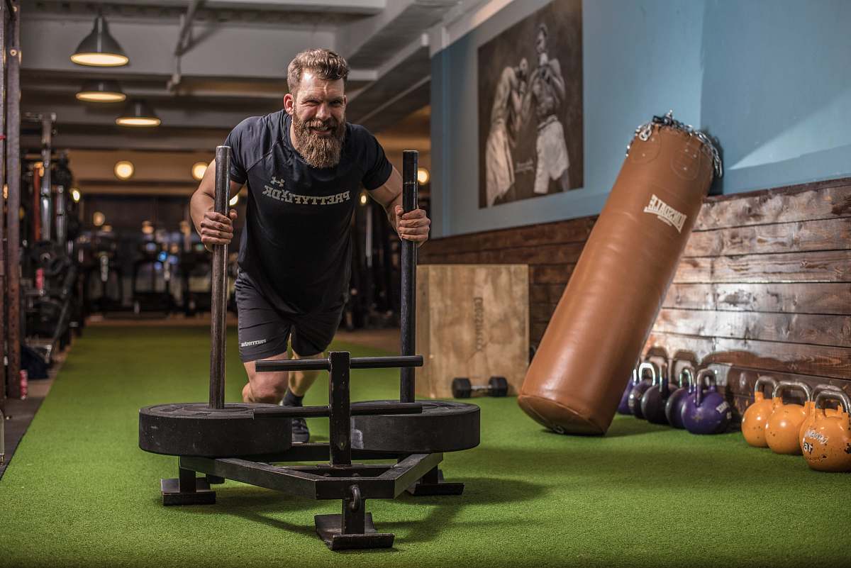 person man exercising inside room people