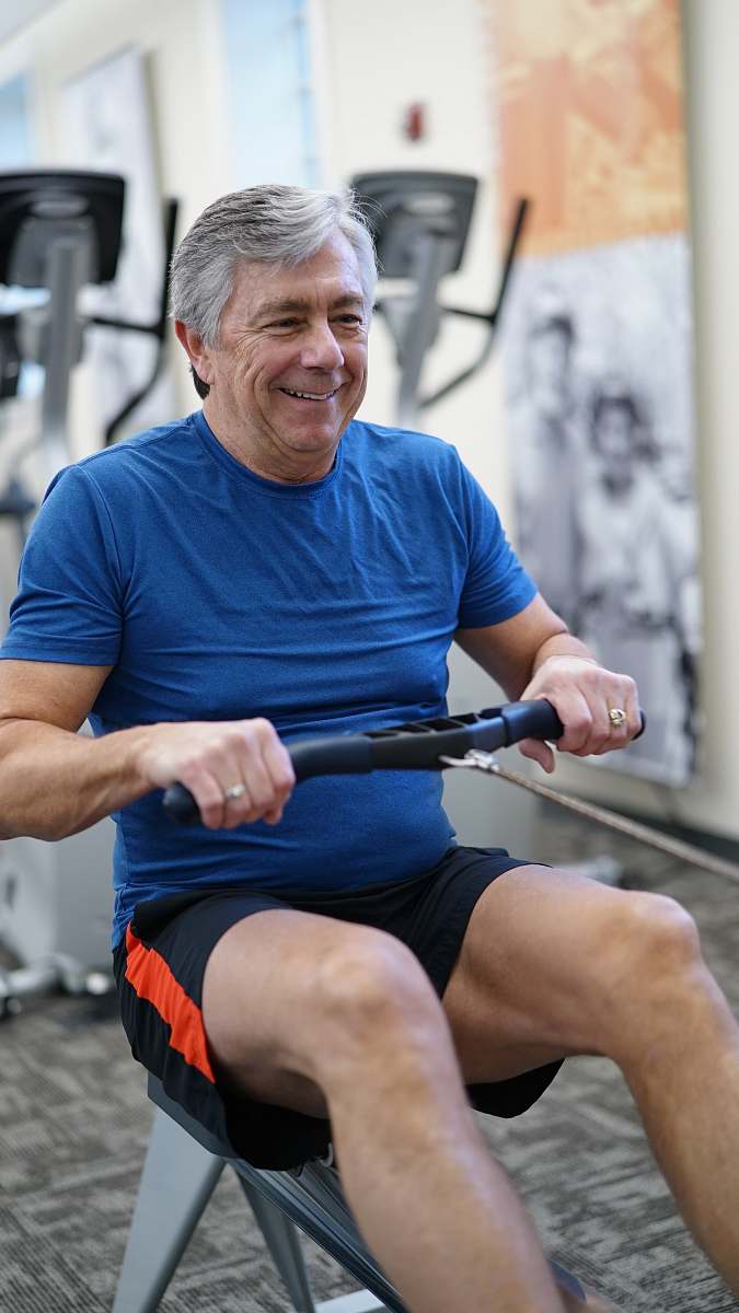 person man exercising while smiling sport