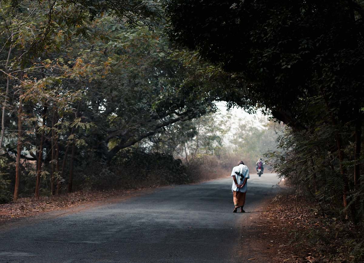 person man in white t-shirt walking at the street fitness