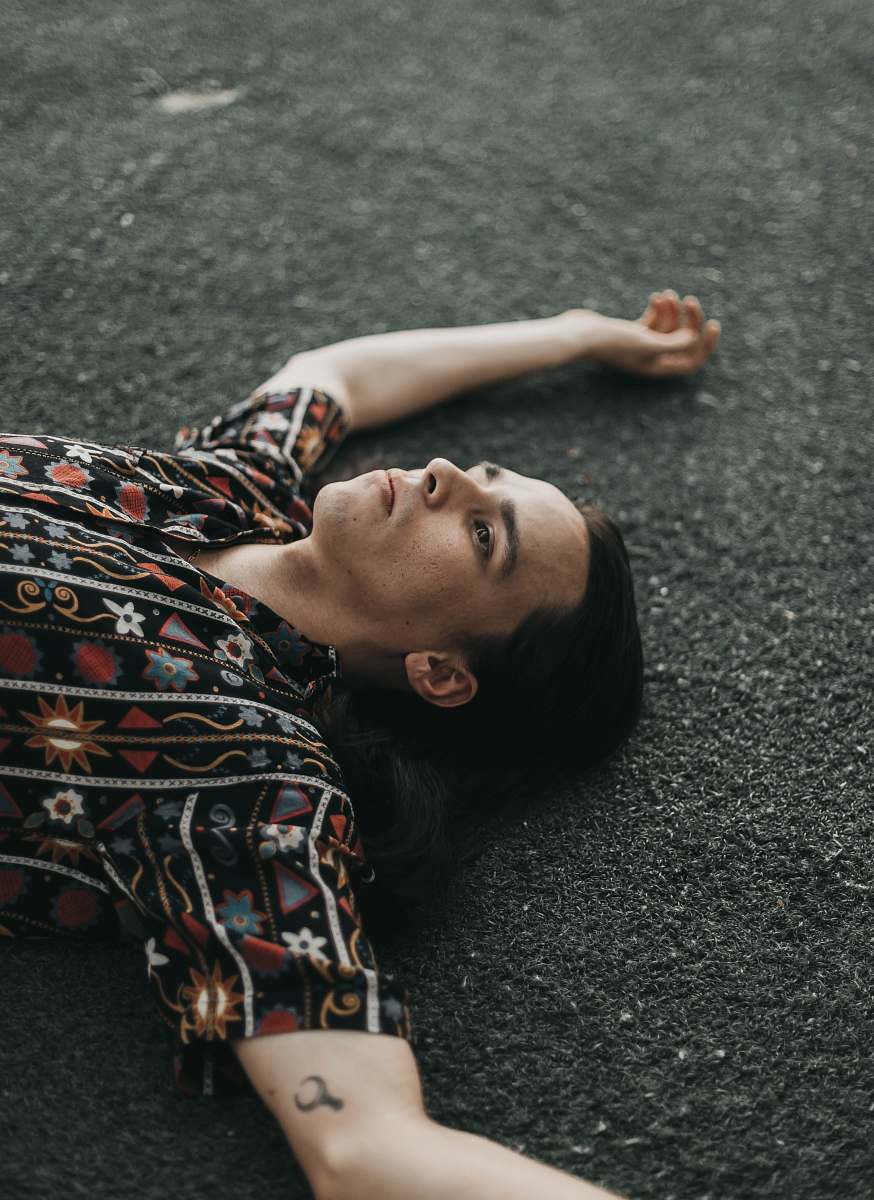 person man lying on concrete road exercise