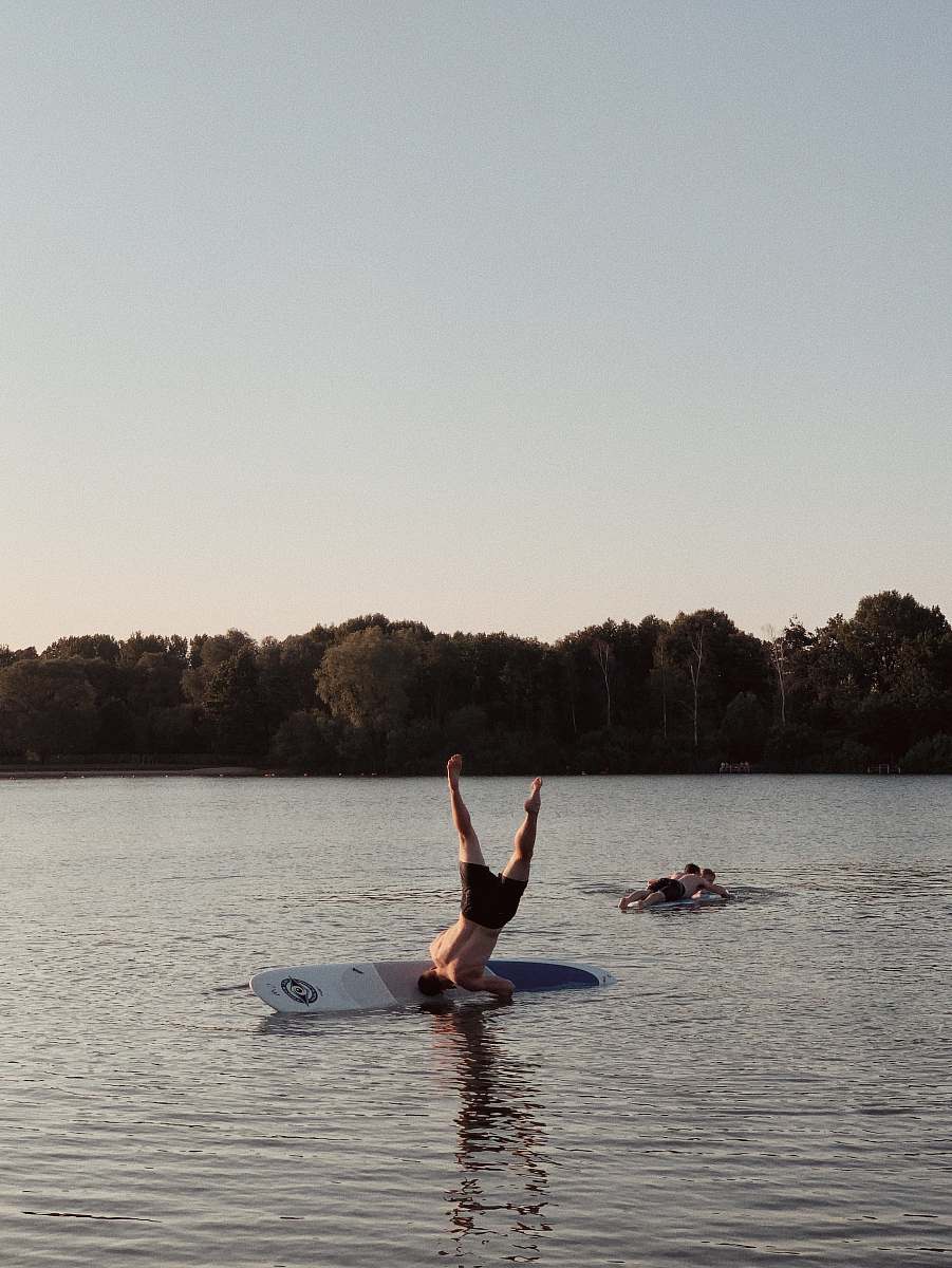 person man on surfboard during daytime water