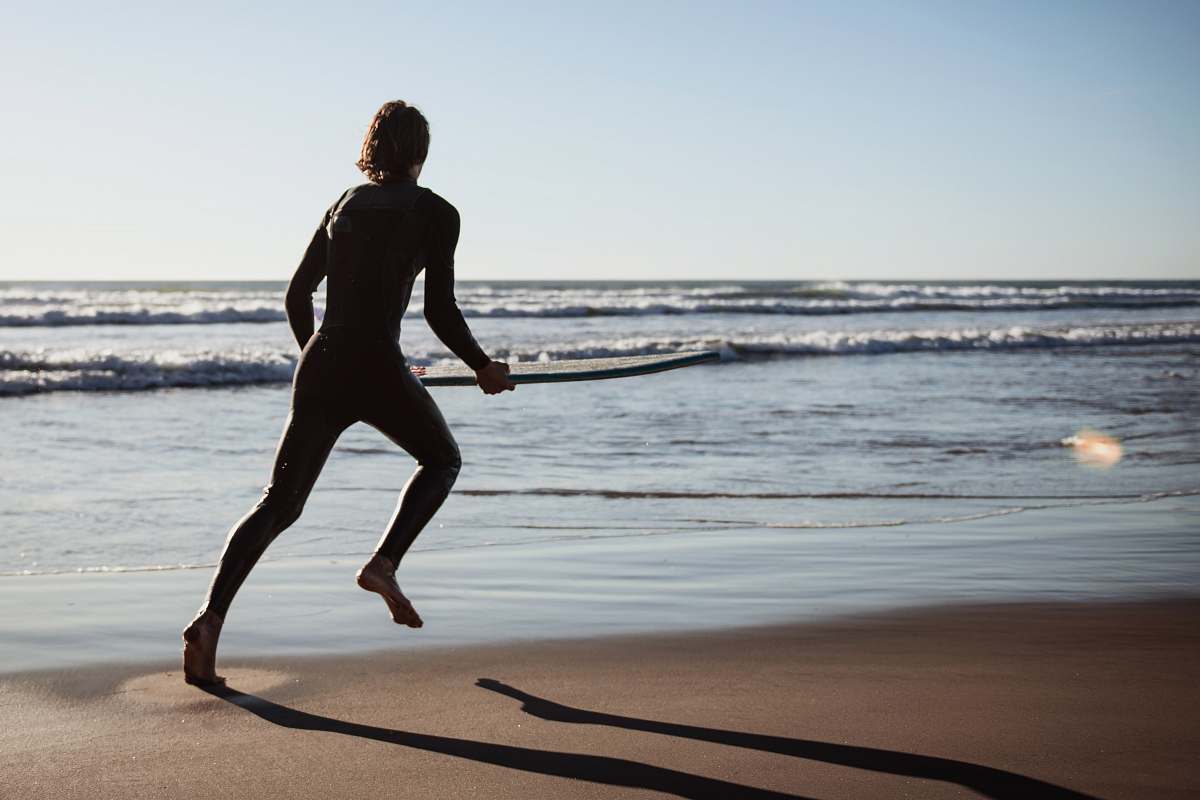 person man running near ocean sports
