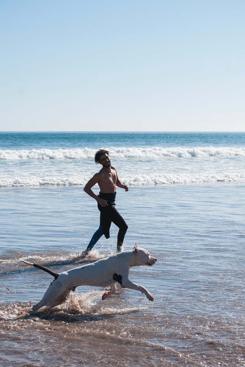 person man running together with dog dog