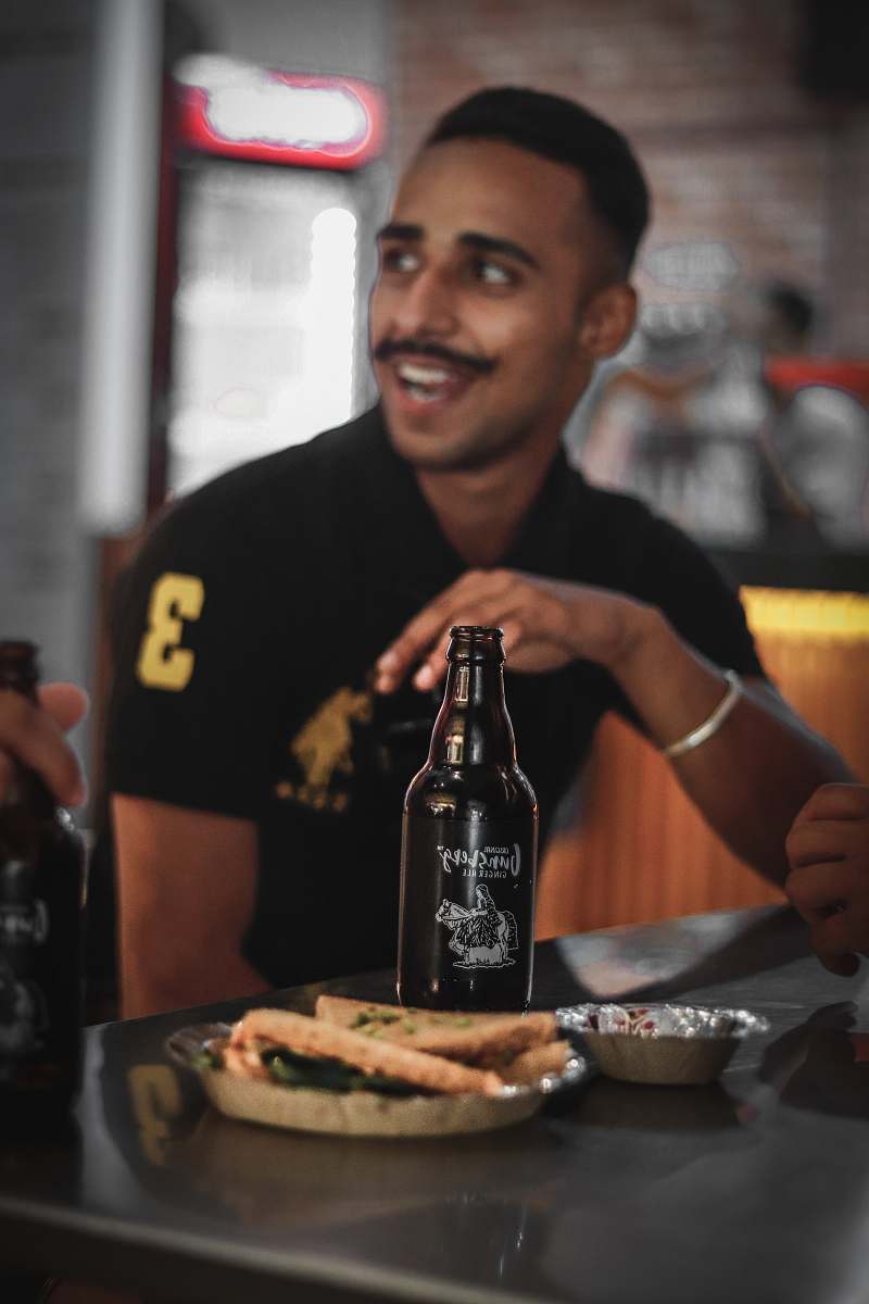 person man sitting at the table alcohol