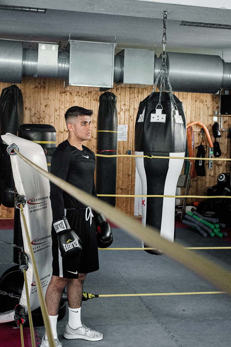 person man standing at the corner of boxing ring exercise