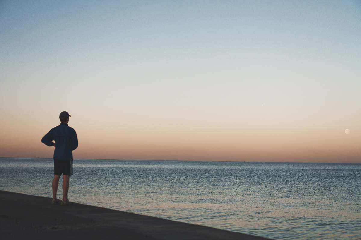 person man standing near sea standing