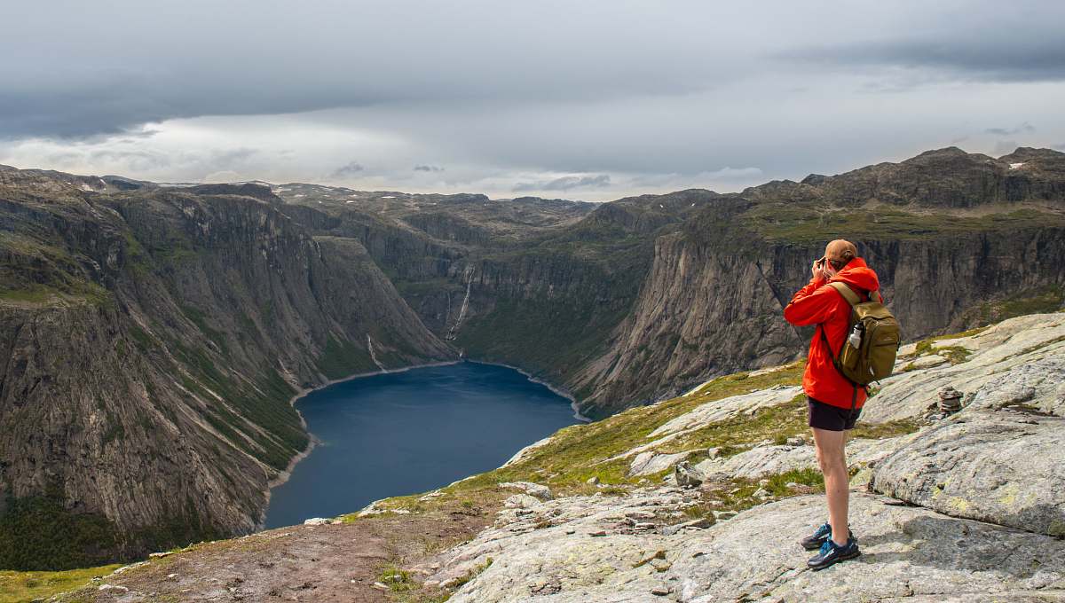 outdoors man standing on cliff slope