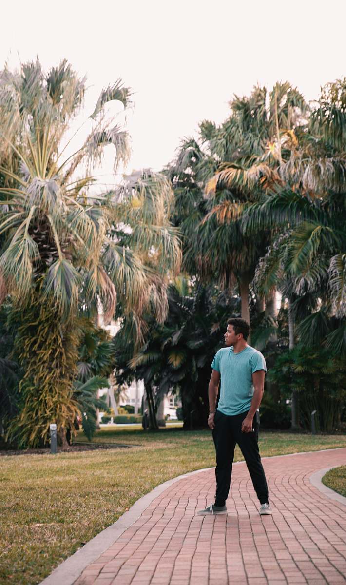 person man standing on pathway apparel
