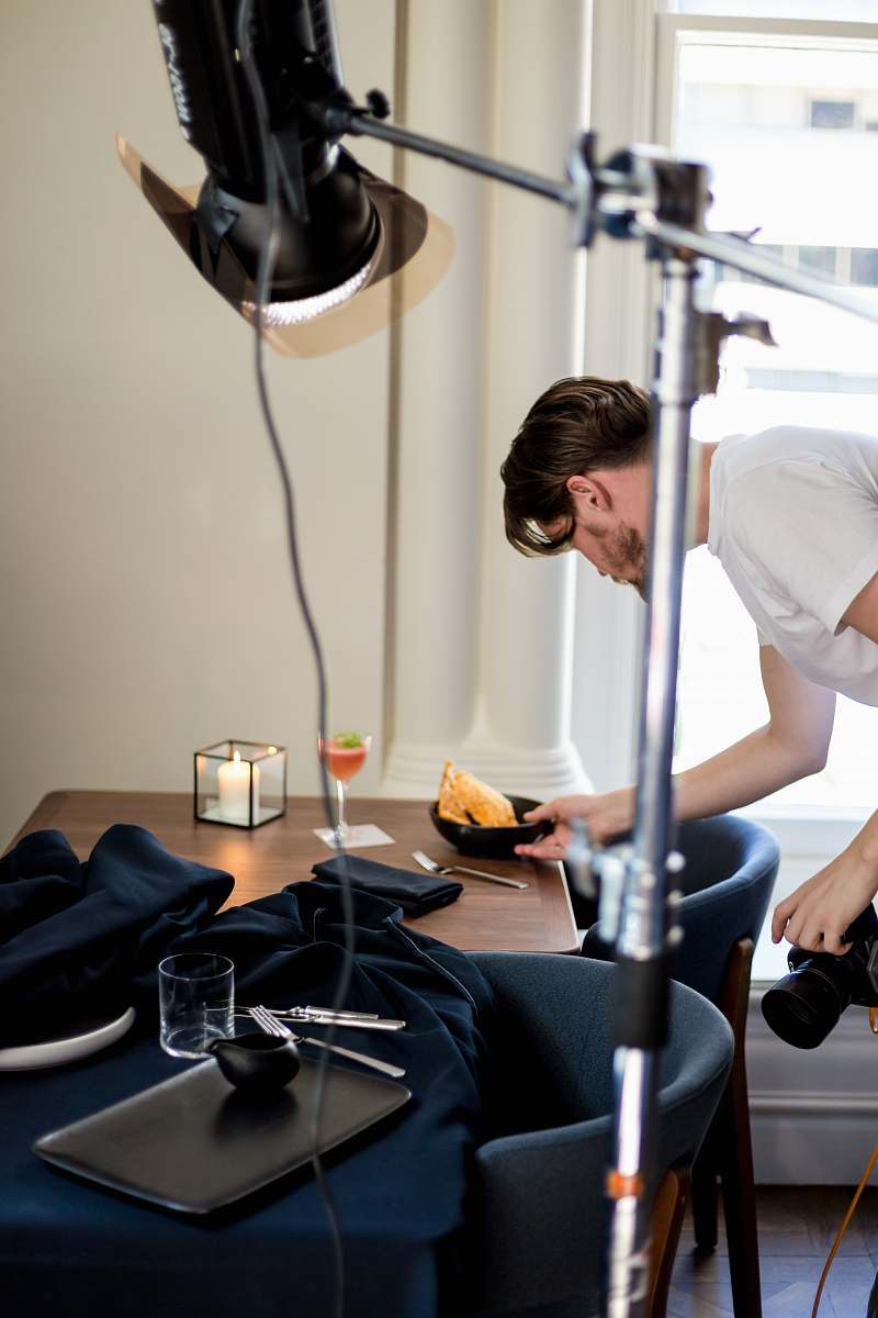 person man taking photo of food platter exercise