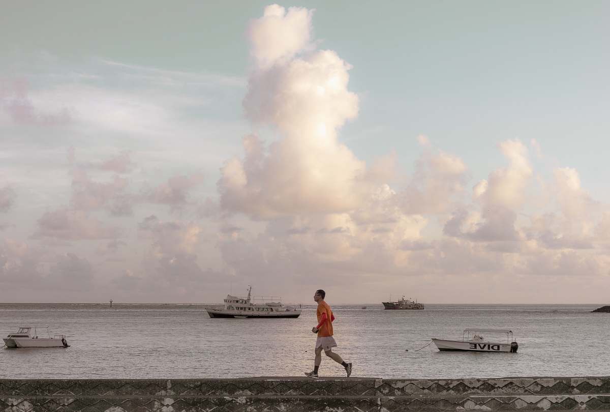 person man walking on bay apparel