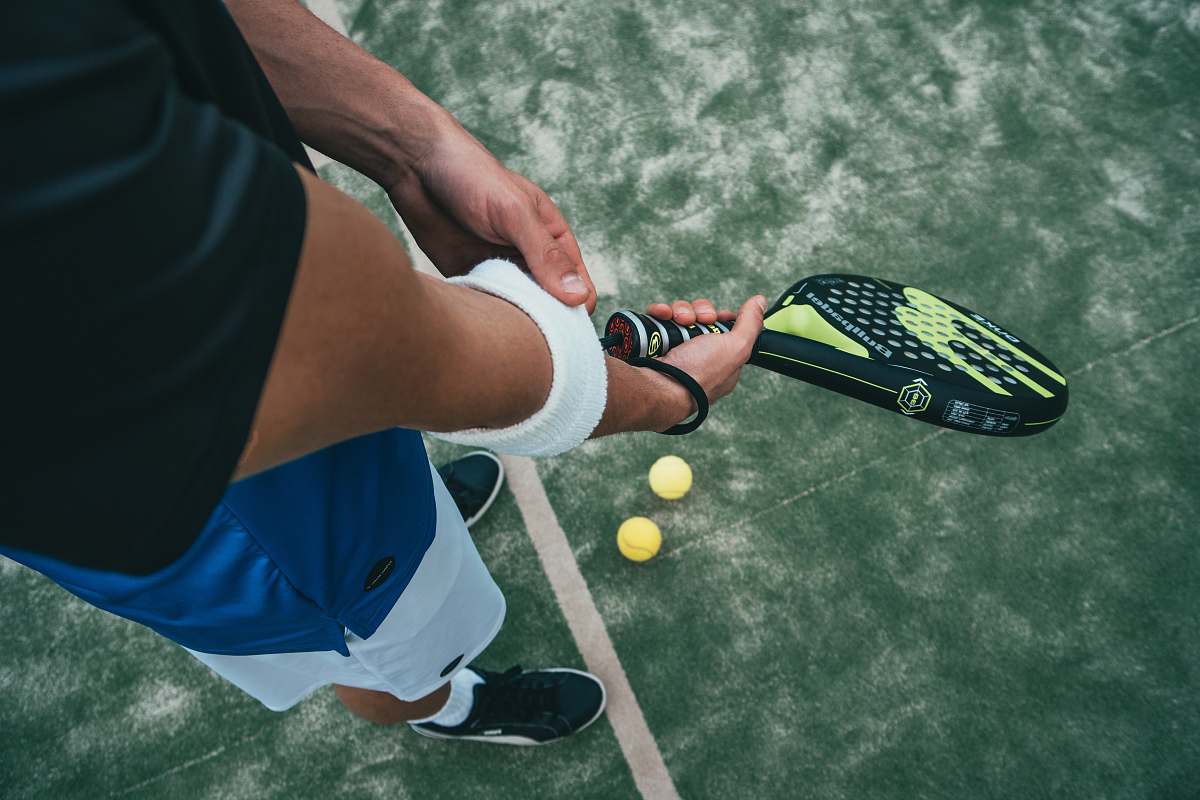 person person holding tennis racket people