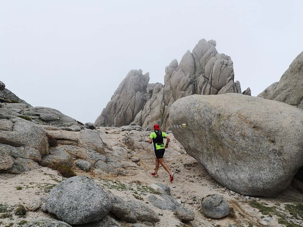 person person running between rock formations madrid