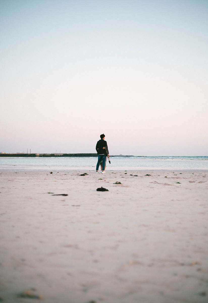 person person standing beside seashore nature
