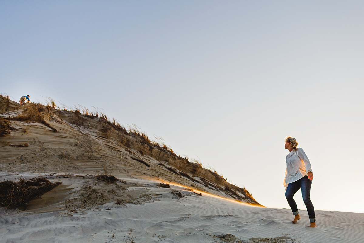 person person standing on mountainside during daytime exercise