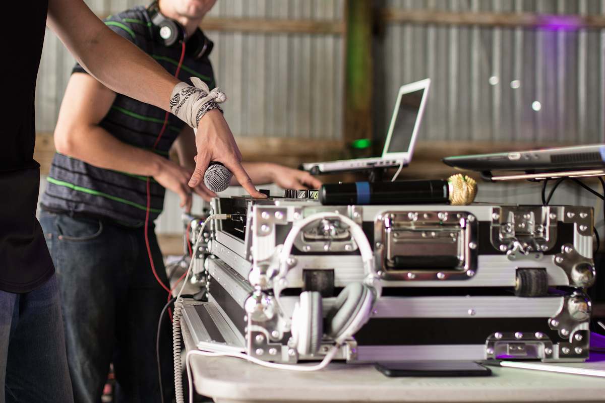 person person using DJ turntable people