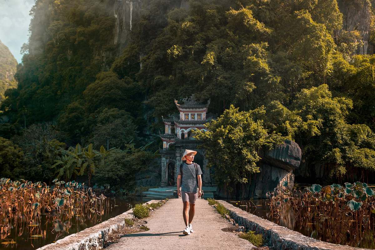 person person walking on dirt pathway pedestrian