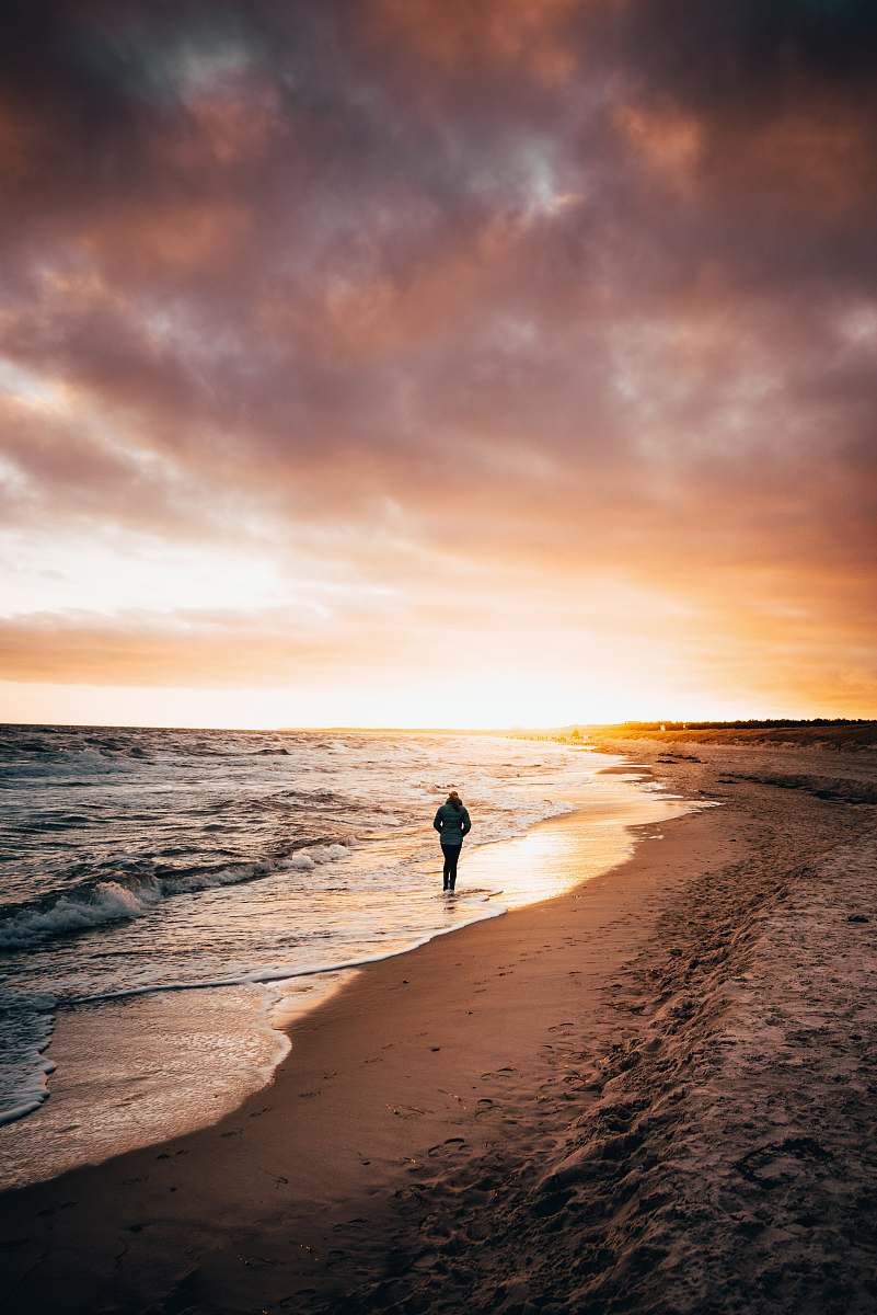 person person walking on seashore nature