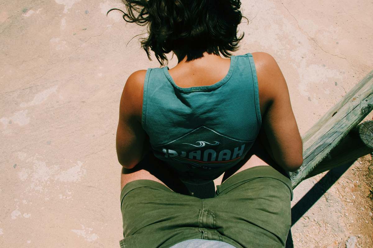 person person wearing teal top on beach apparel