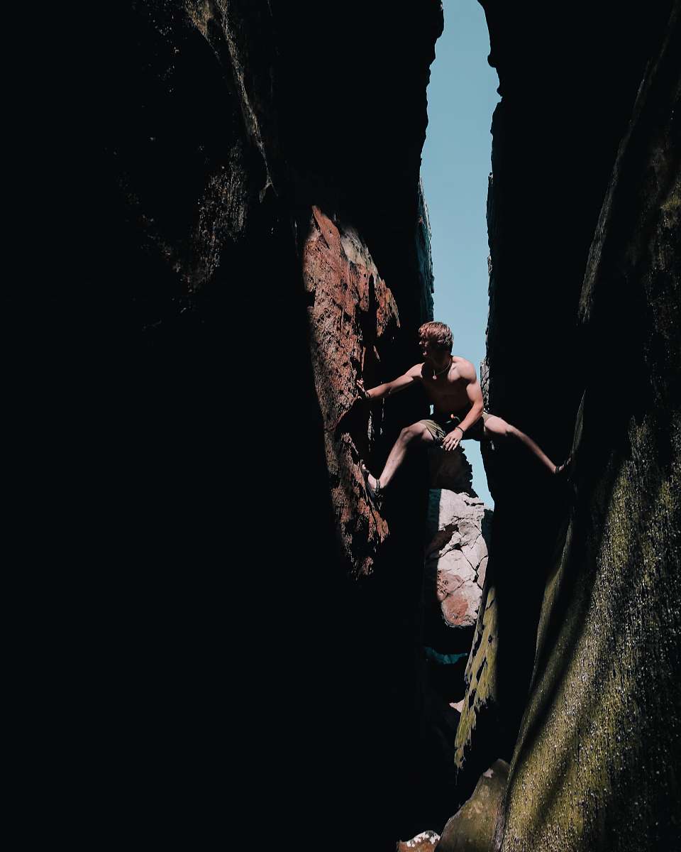 people rule of thirds photography of man climbing mountain person